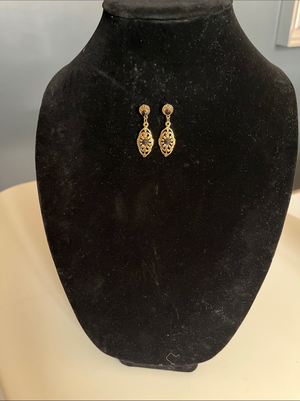 Gold Drop Floral Dangle Earrings with Black Stone